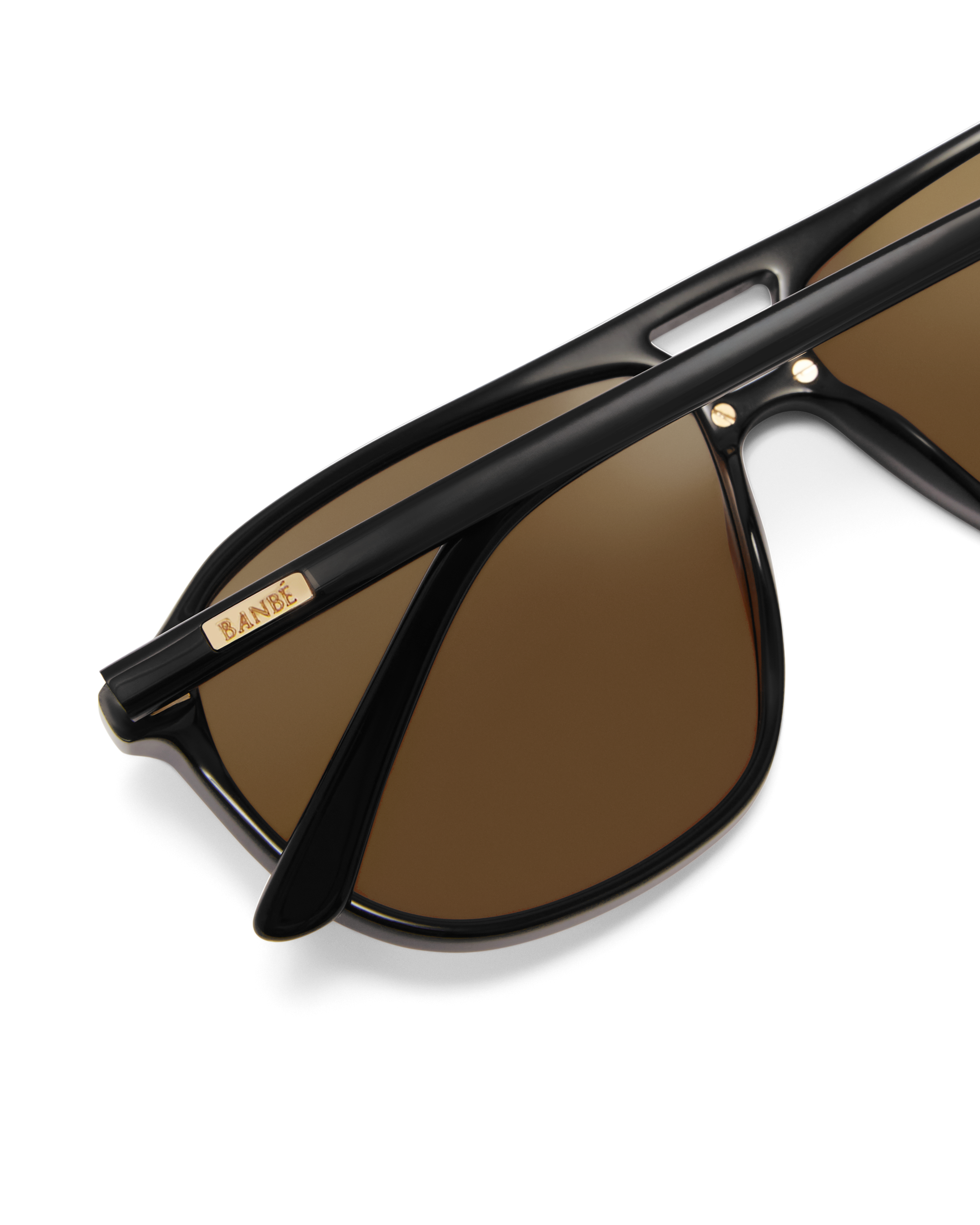 Oversized women's aviator sunglasses with a, flat-top brow bar, keyhole cut, double bridge, and slim arms.