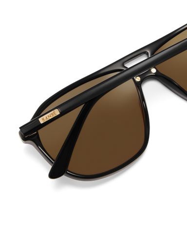 Oversized women's aviator sunglasses with a, flat-top brow bar, keyhole cut, double bridge, and slim arms.